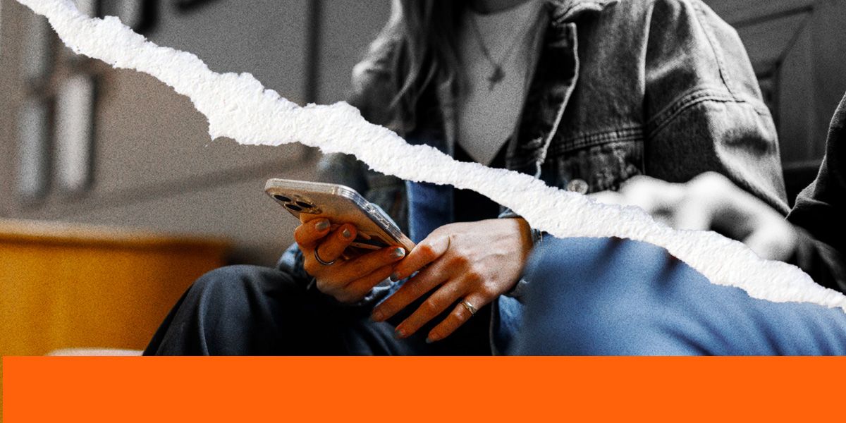 A student holding a mobile phone with a rip effect cutting across the image.