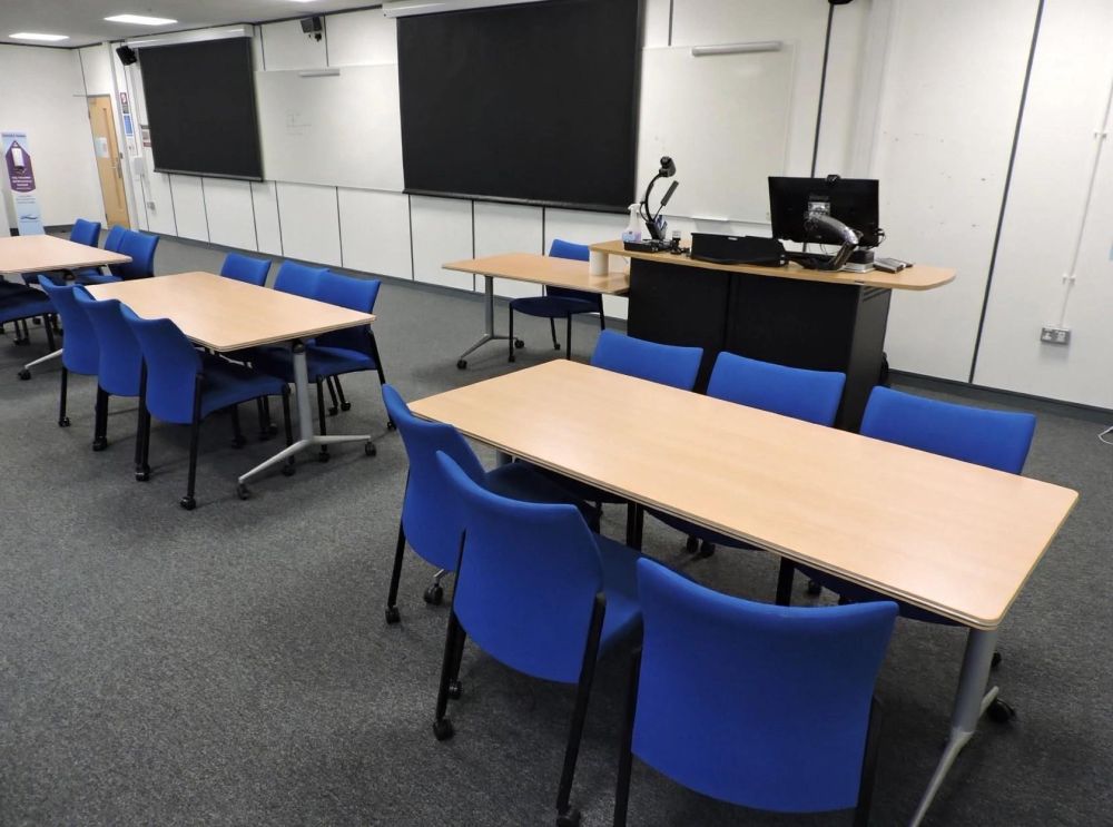 A room with tables and chairs
