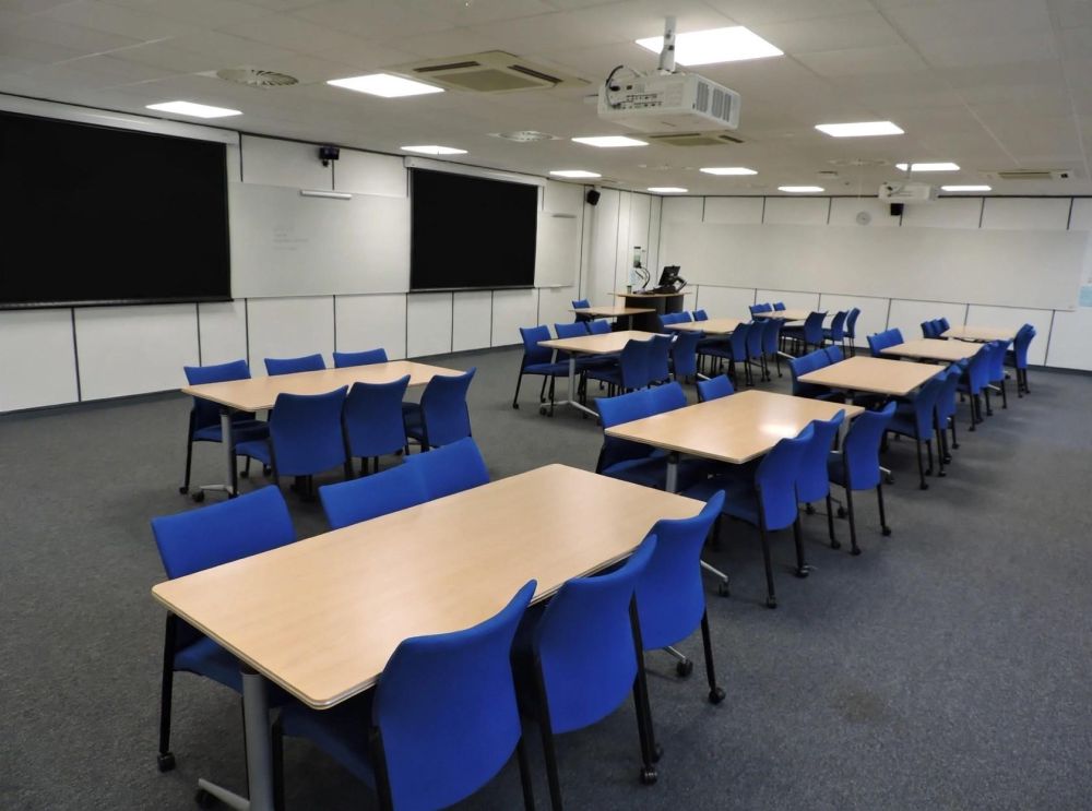 A room with tables and chairs