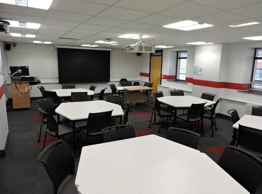 A room with tables and chairs