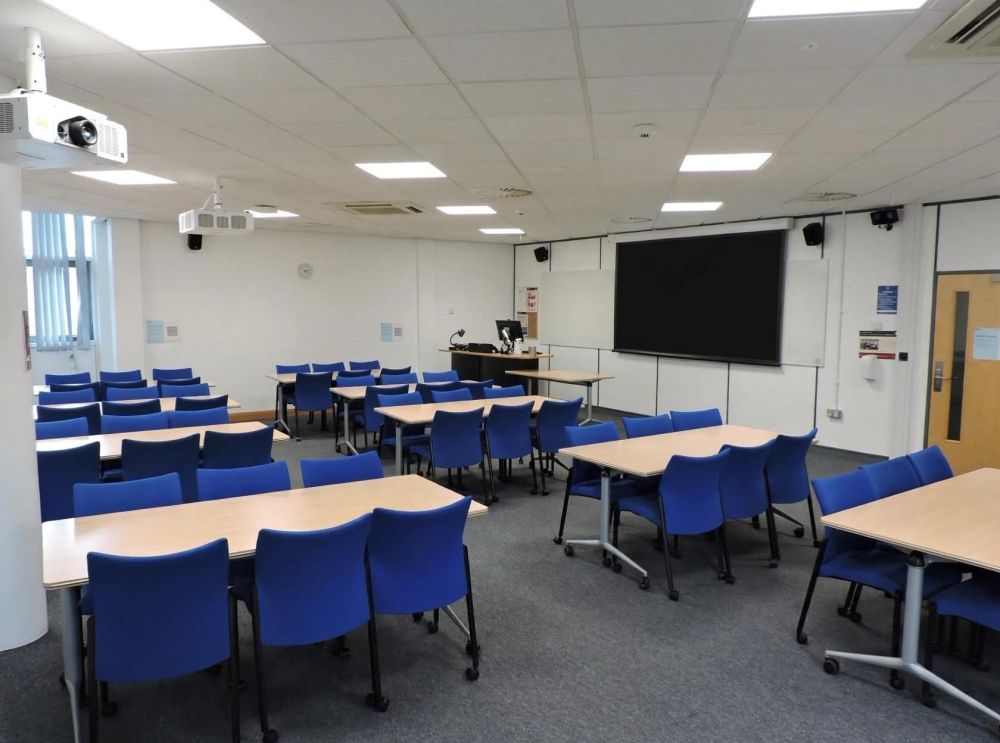 A room with tables and chairs
