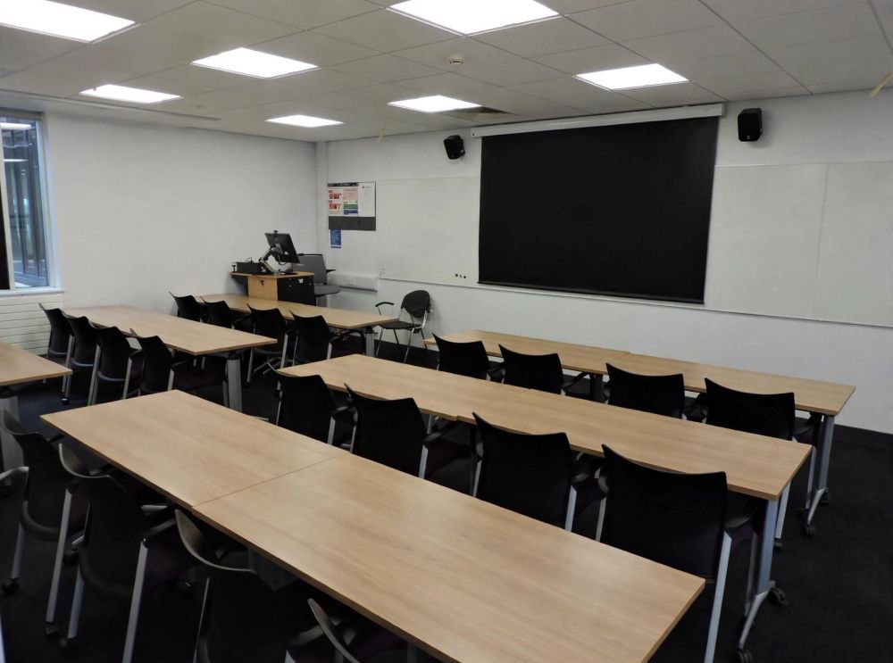 A room with tables and chairs