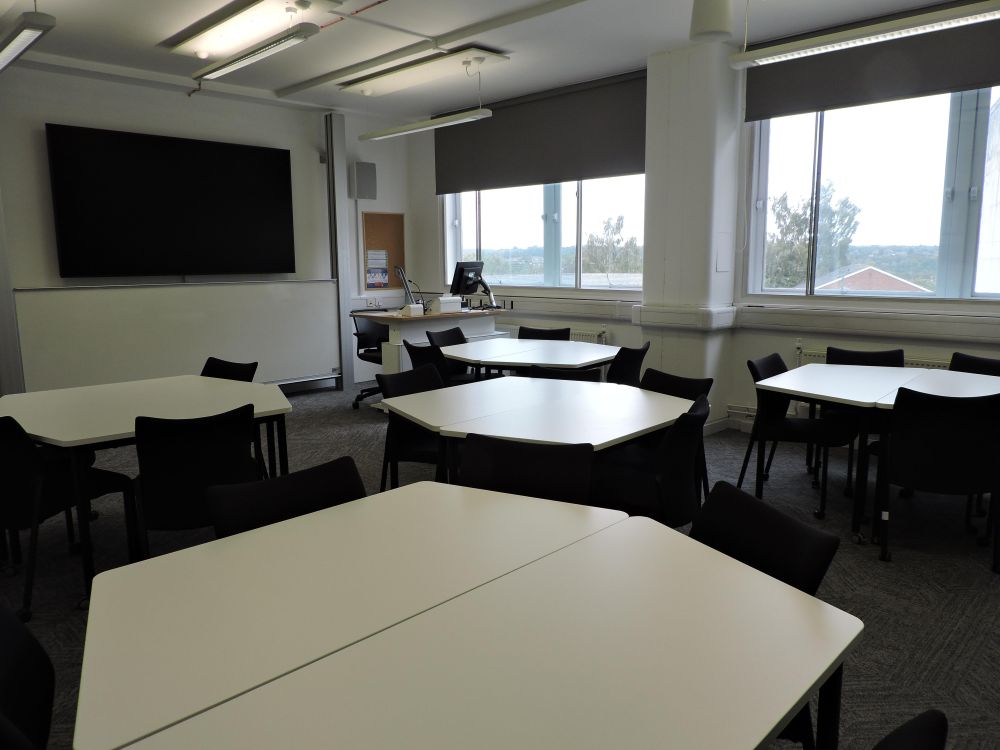 A room with hexagonal tables.