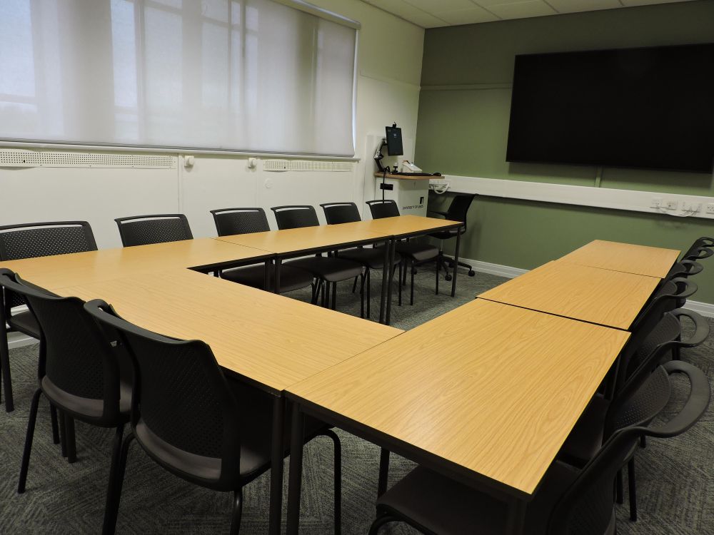 A set of tables in a horseshoe shape