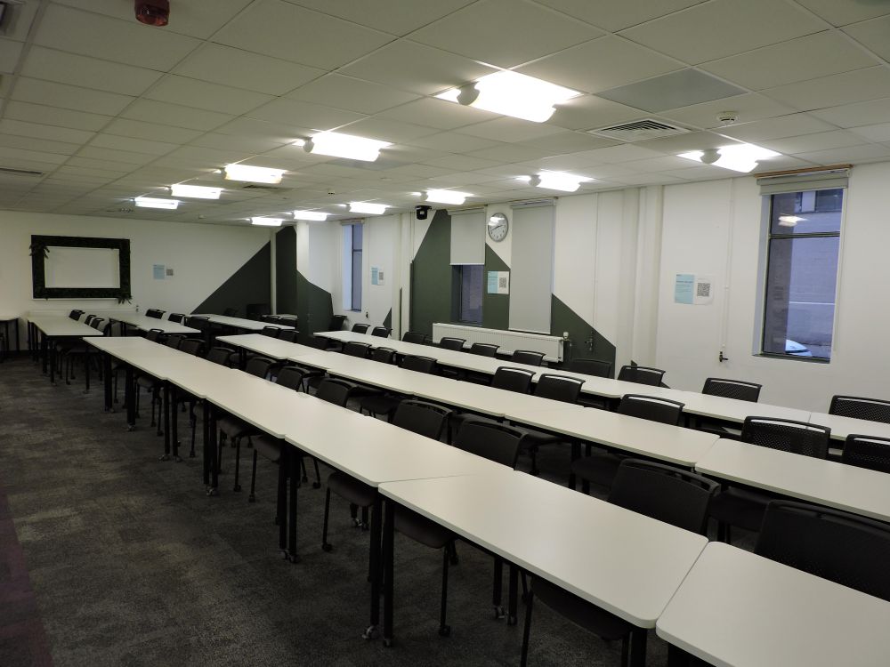A large room with tables and chairs