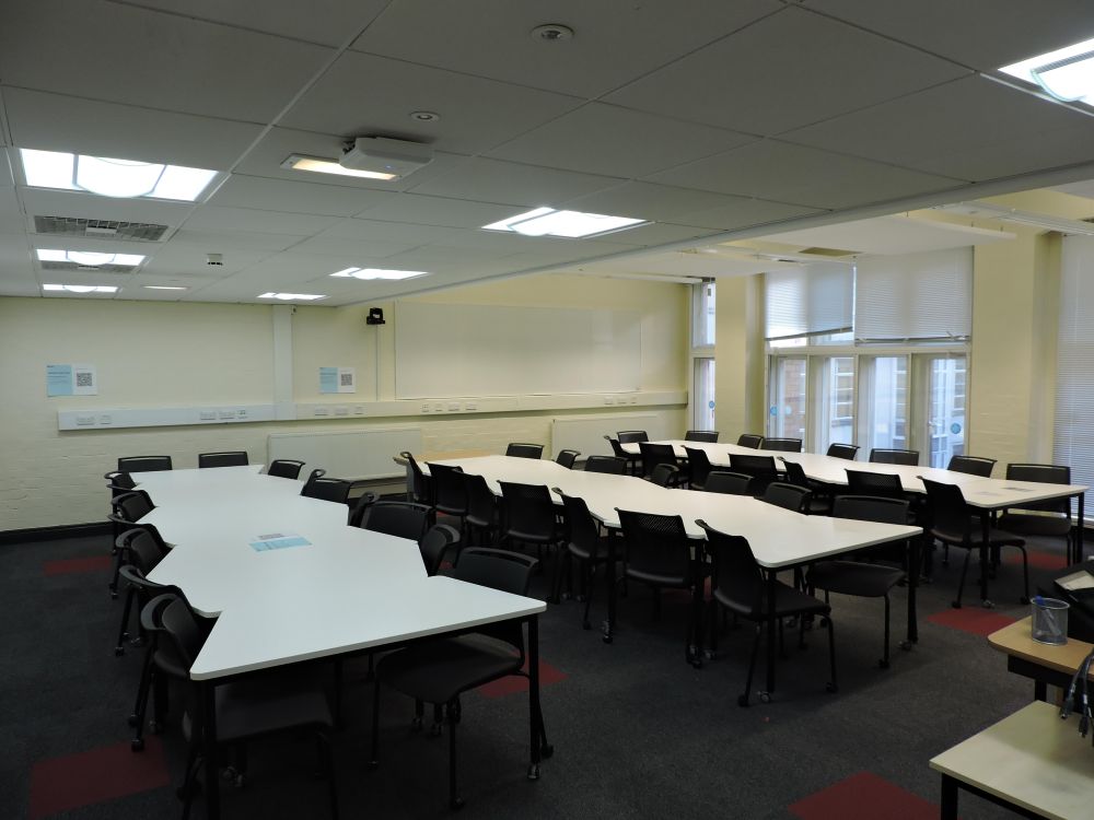 A room with tables and chairs