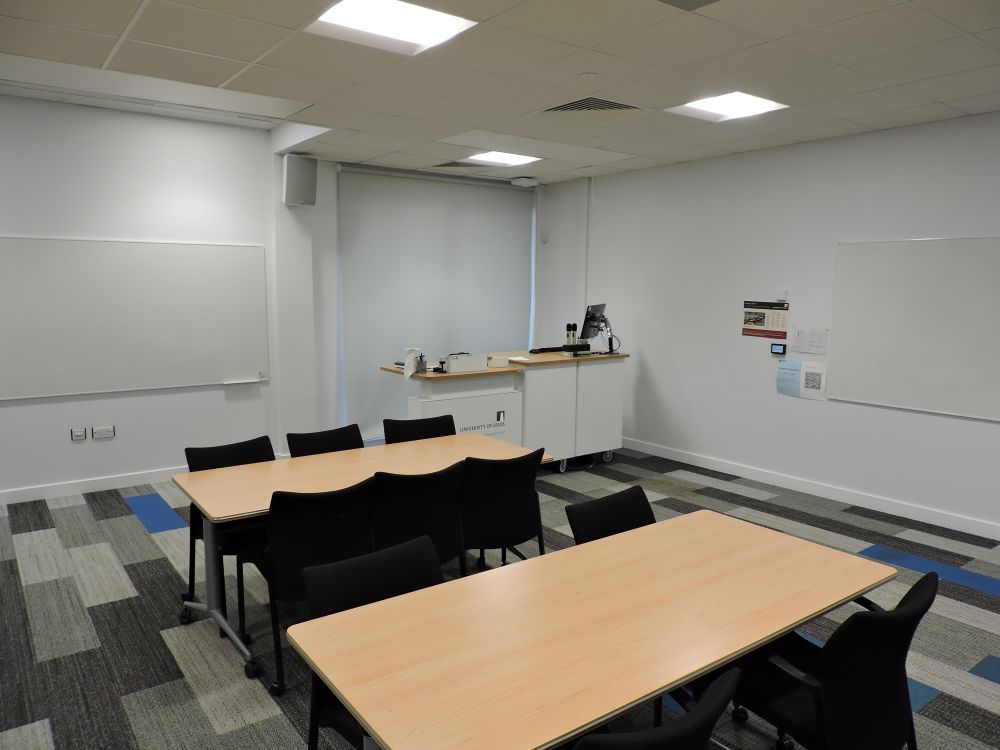A room with tables and lectern