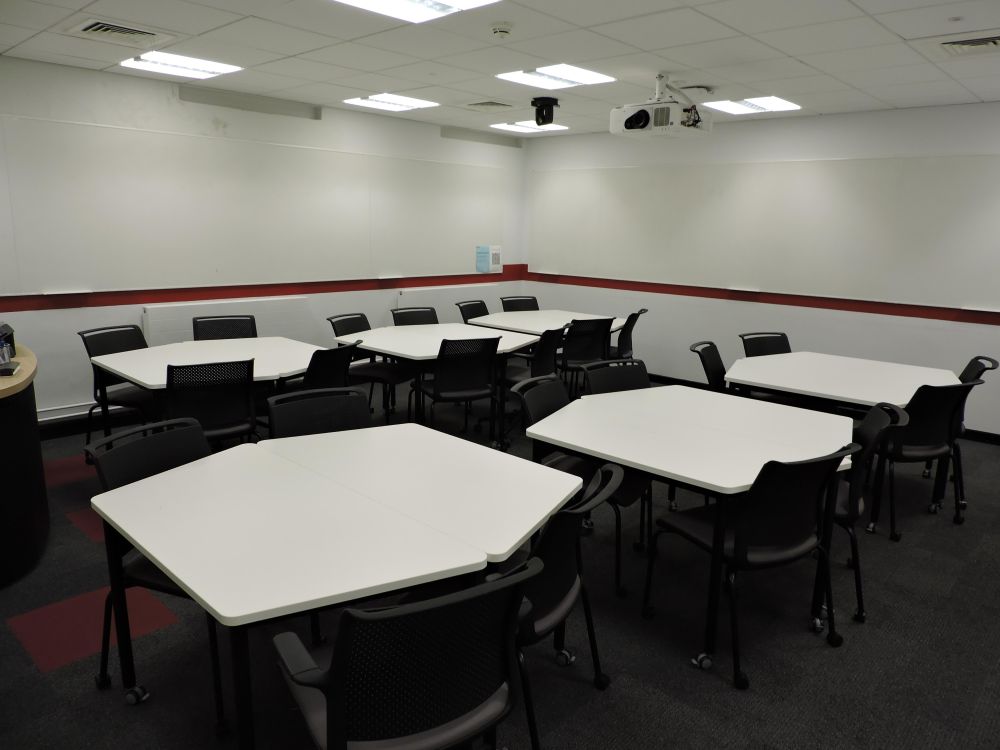A room with tables and chairs