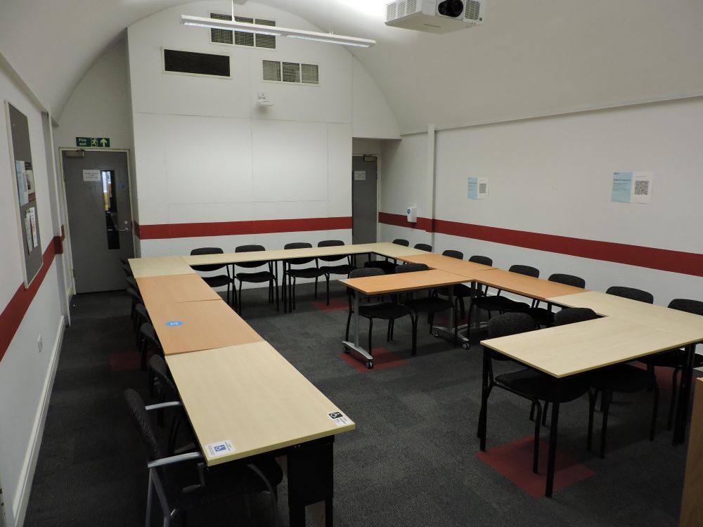 A room with tables and chairs
