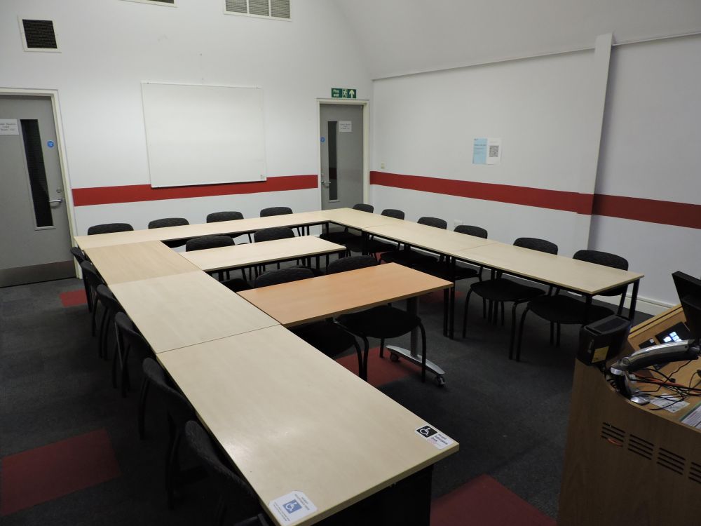 A room with tables and chairs