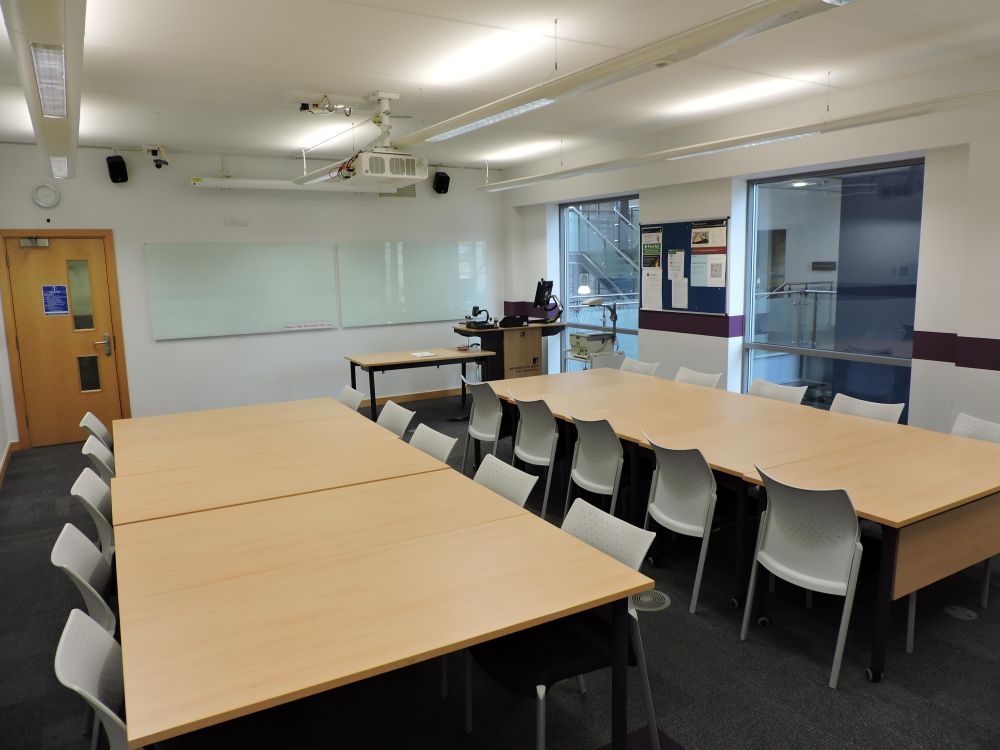 A room with chairs and tables