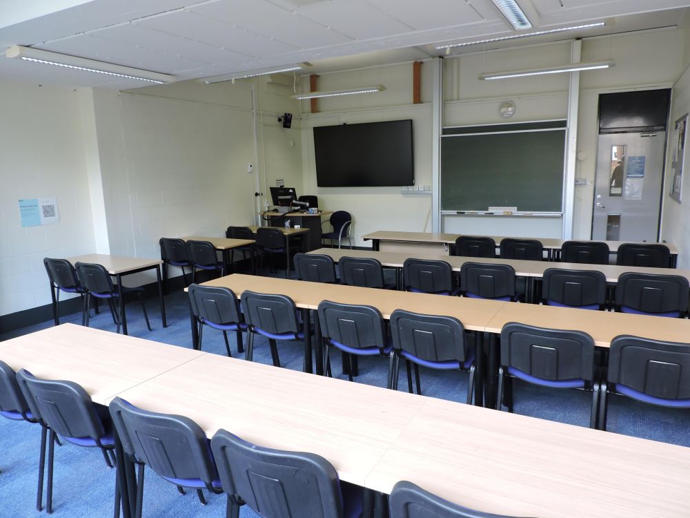 A room with tables and chairs.
