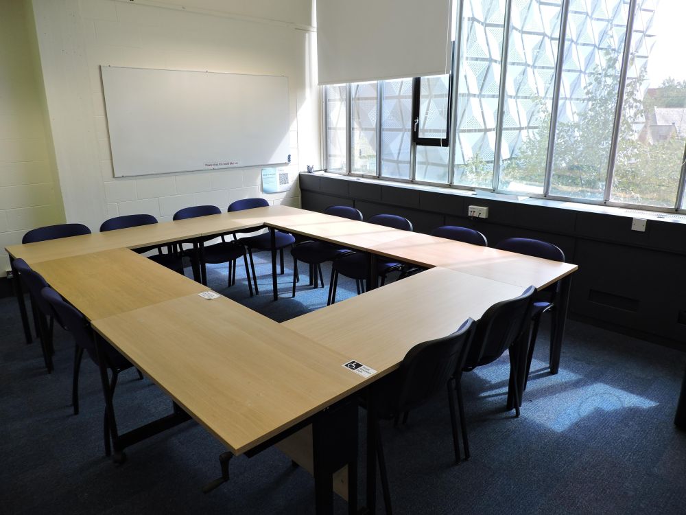 A room with tables and chairs