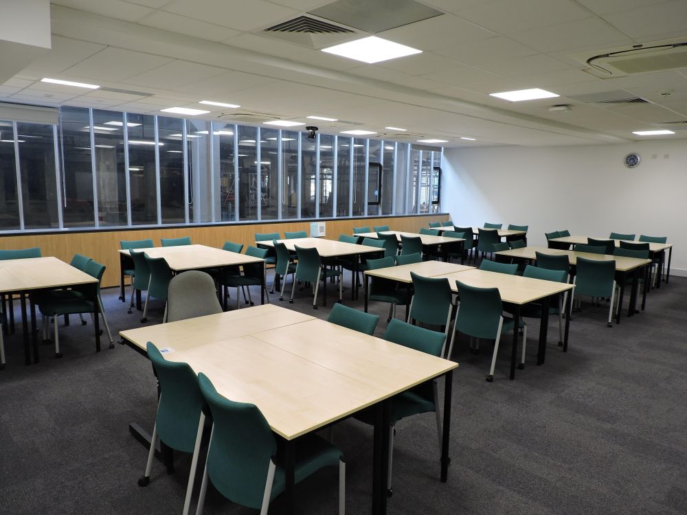A room with tables and chairs