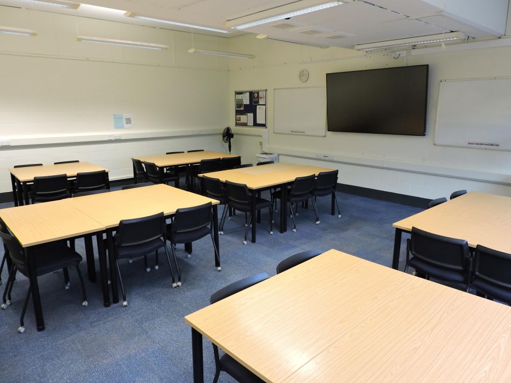 A room with tables and chairs