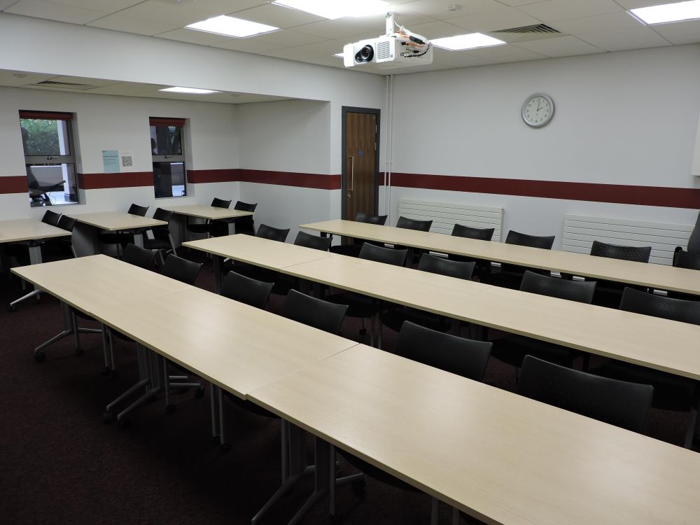 A room with tables and chairs