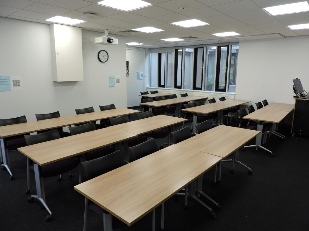 A room with tables and chairs