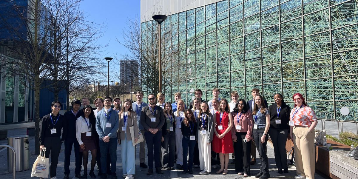 A group of students standing outside of Newcastle University