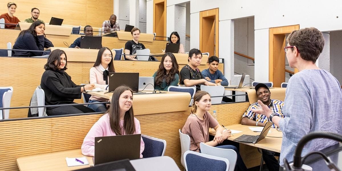 Students in a lecture theatre listening to a speaker