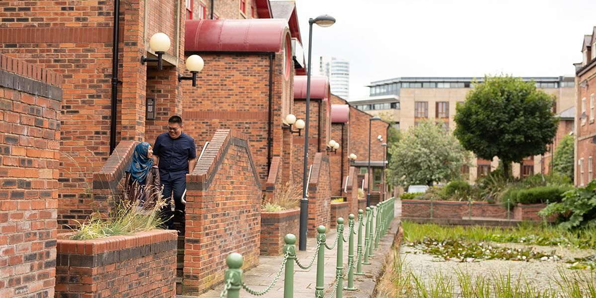 Two students leaving their accommodation