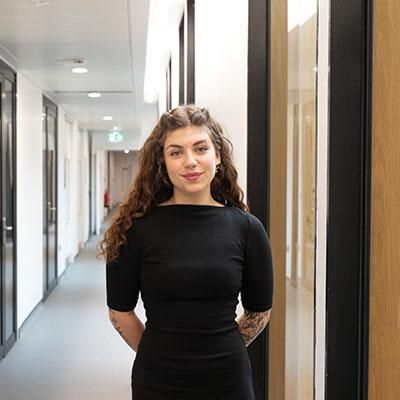 Sarah Clayton, founder of Breathe and Birth, standing in a corridor