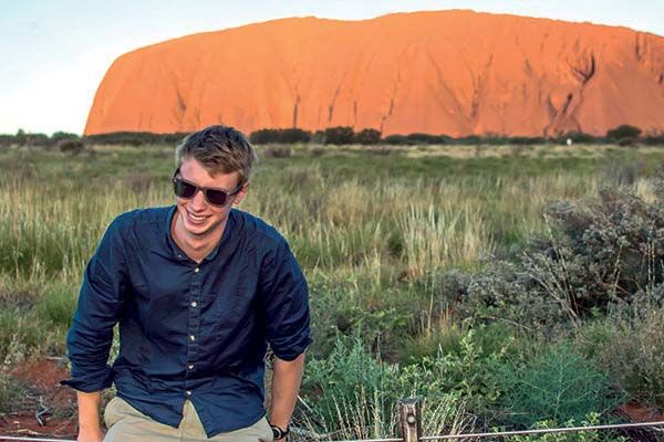 Student smiling near Uluru/Ayers Rock in Australia.