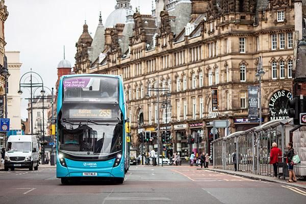 A bus driving outside Leeds Kirkgate Market