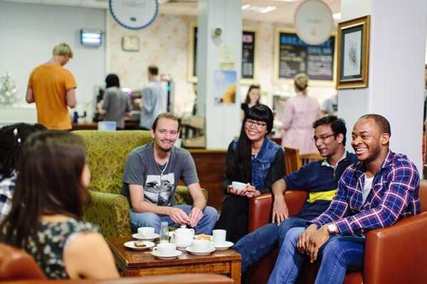 A group of students sitting and chatting at Global Cafe