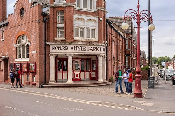 Students looking at listings outside Hyde Park Picture House