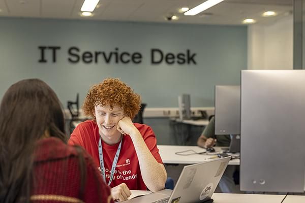 IT Service Desk staff member helping student
