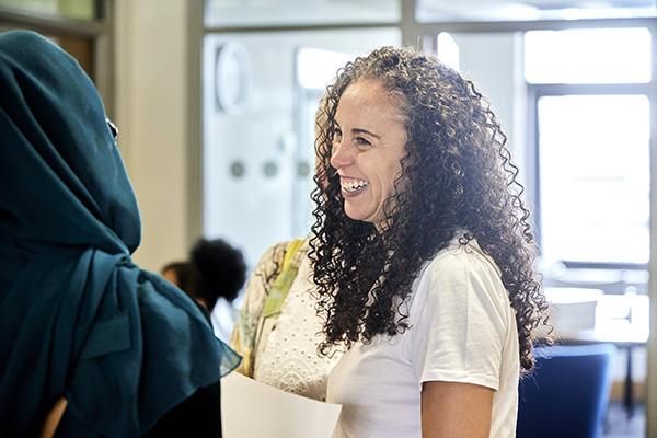 A mature student chatting at a Lifelong Learning Centre event