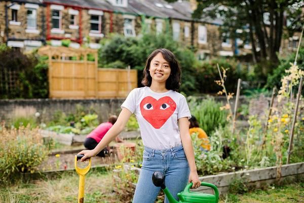 A student volunteering in a garden in Hyde Park