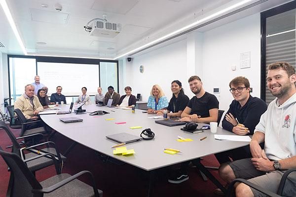 People sitting around a table in a Spark business workshop