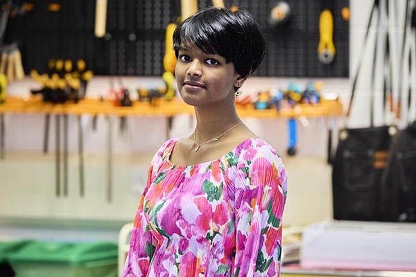 Tanvi Manikoth stood in a workshop.