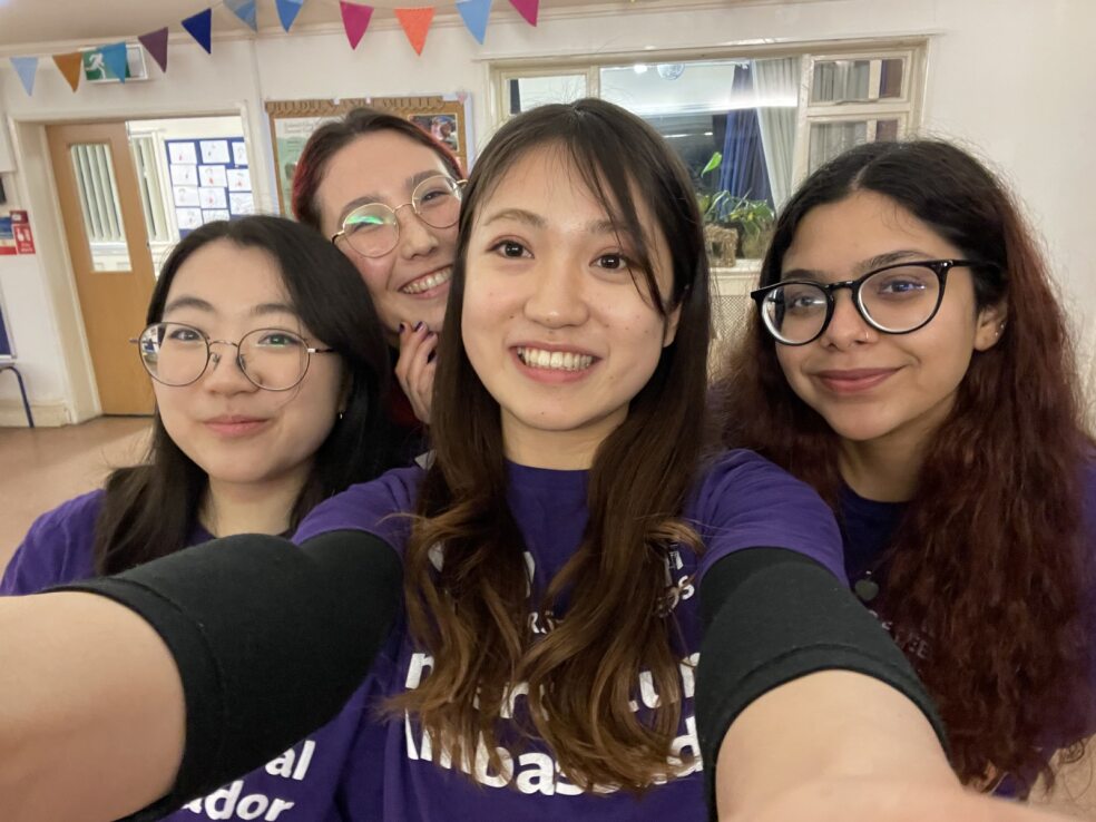 Four students posing for a selfie.