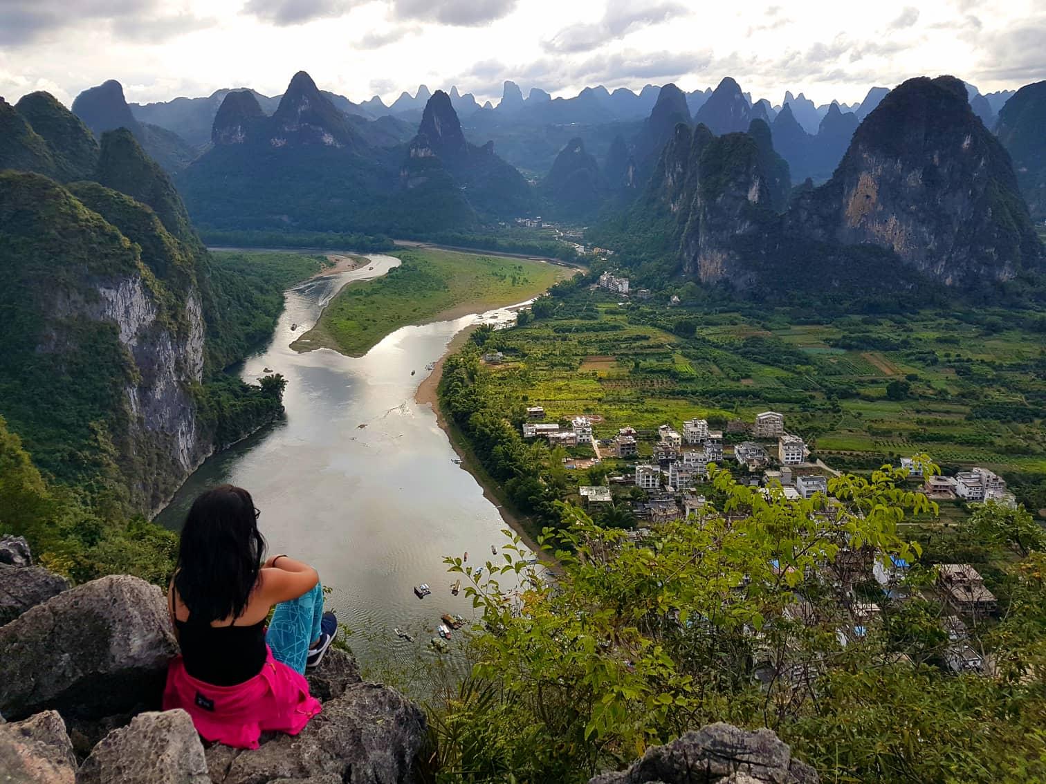 Student looking over mountains in China
