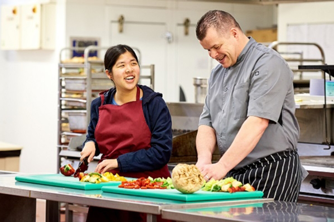 Student cooking in University kitchen