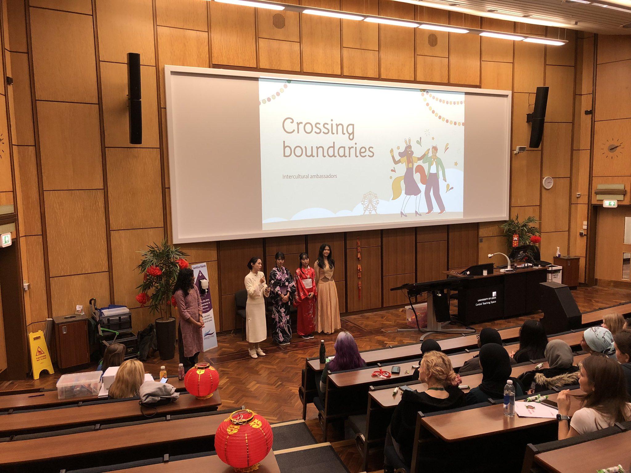 Students presenting in a lecture theatre.