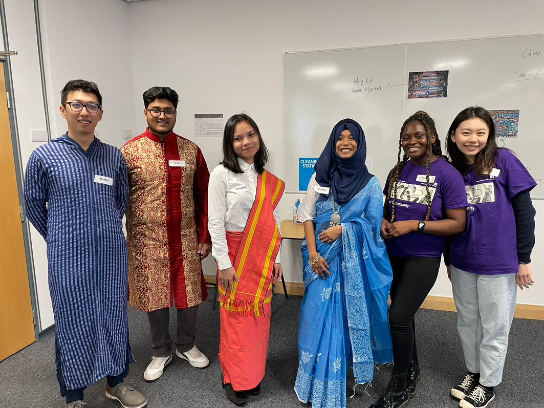 A group of students wearing traditional clothes from different countries. 