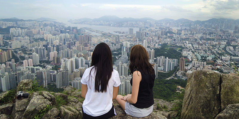 Students looking out of the Hong Kong cityscape